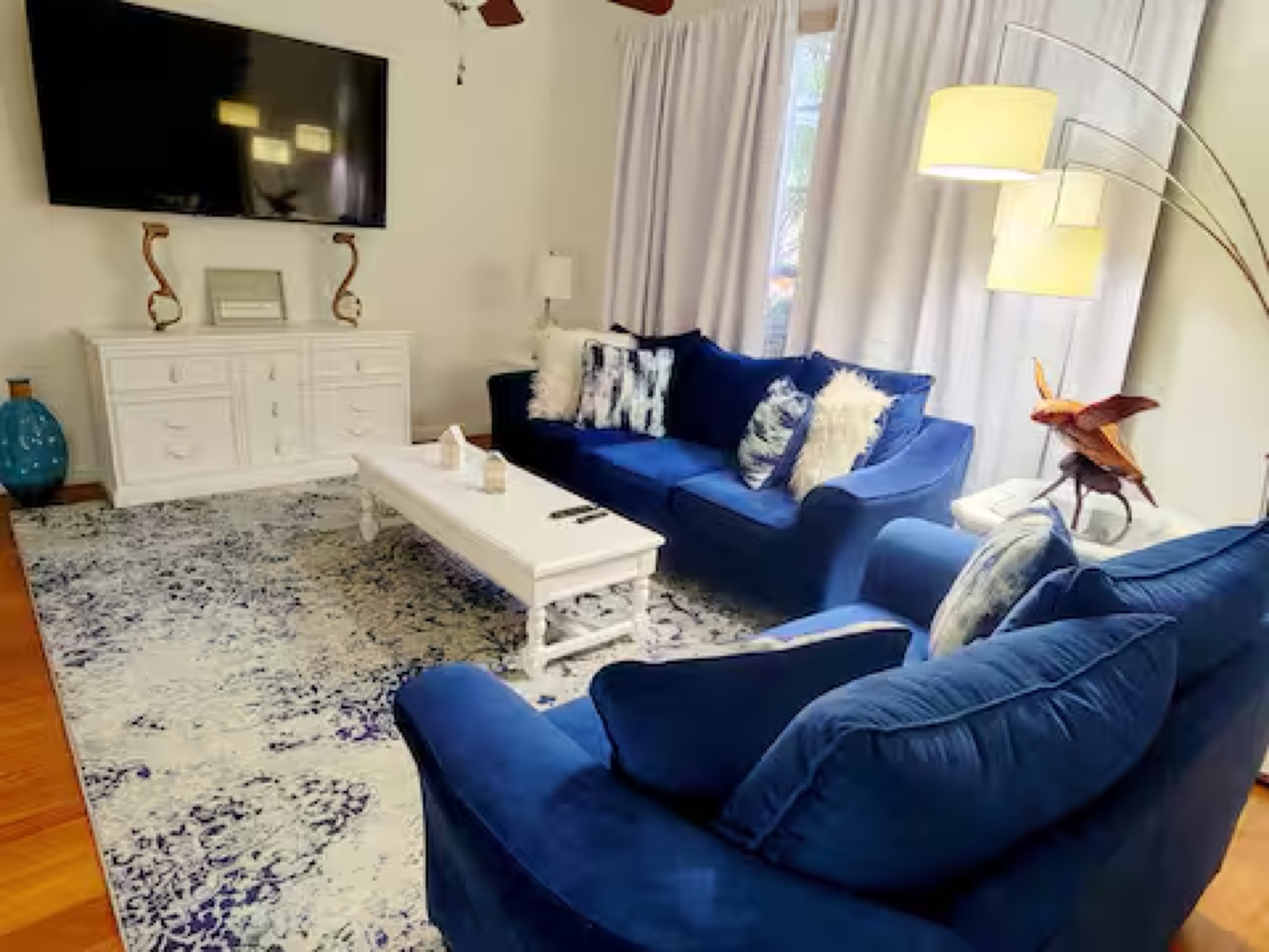 Living room with navy velvet sofas