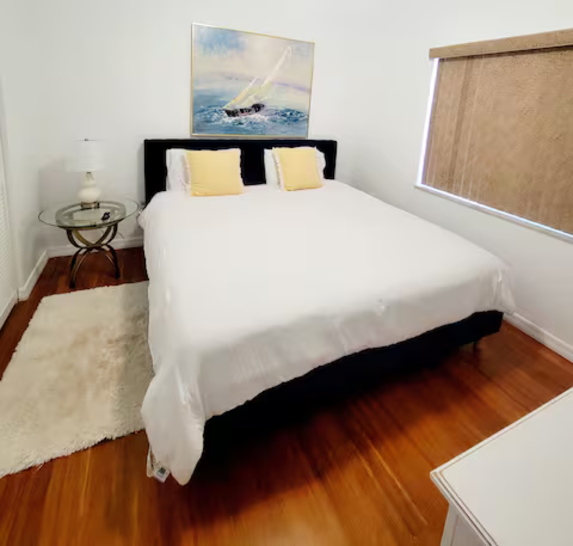 Second king bedroom with sailing ship painting above the bed